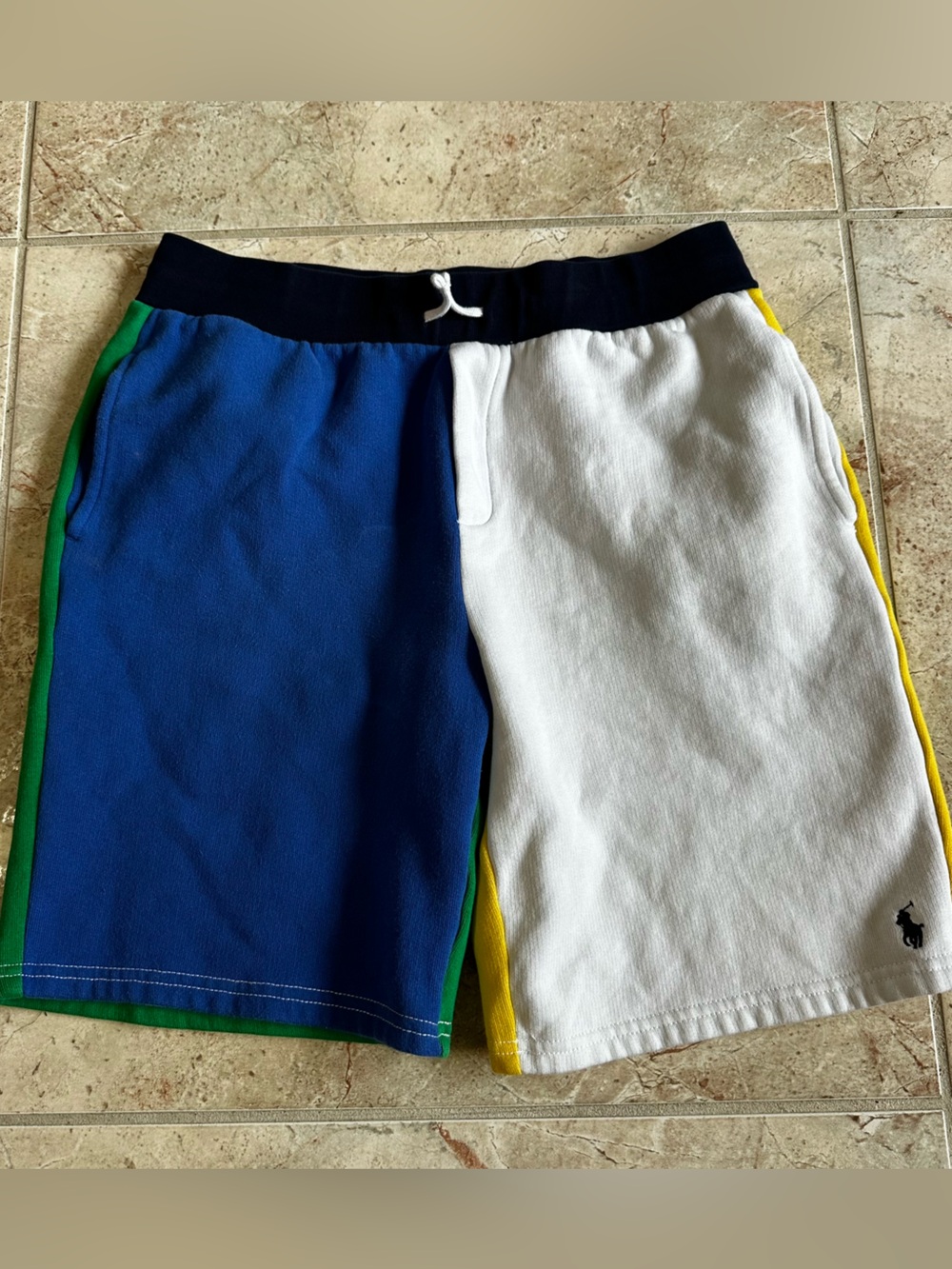 Ralph Lauren white sweat shorts with bold yellow, green, and blue side panels.